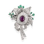 An Amethyst, Diamond and Emerald Brooch, an oval mixed cut amethyst centres a floral design, pavé