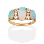 A Late 19th Century Opal and Diamond Ring, three graduated oval cabochon opals spaced by