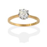 A Diamond Solitaire Ring, the old mine cut diamond within white claws on a yellow tapered shoulder