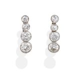 A Pair of Diamond Drop Earrings, four graduated old cut diamonds in millegrain settings, total