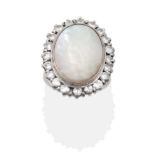 A Mother-of-Pearl and Diamond Cocktail Ring, the flat mother-of-pearl in a white collet setting,