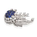 A Diamond and Sapphire Brooch, circa 1950, of stylised floral form set with round cut sapphires,