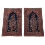 Pair of Kashan Prayer Rugs Central Iran, circa 1930 Each with a deep indigo field and tree in