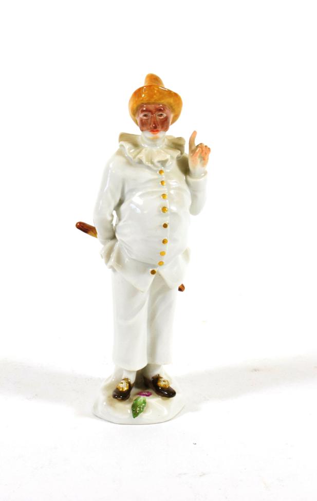 A Meissen Porcelain Figure of Pulcinella, 20th century, standing wearing a brown hat holding a