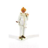 A Meissen Porcelain Figure of Pulcinella, 20th century, standing wearing a brown hat holding a