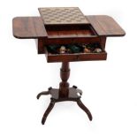 A Regency Mahogany and Ebony Strung Pedestal Gaming Table, early 19th century, the sliding chess top