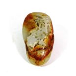 A Chinese Celadon and Russet Jade Pebble, Qing Dynasty, carved with lotus, 7cm long. Some typical