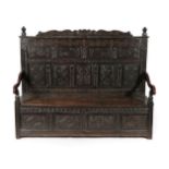 A 17th Century Joined Oak Settle, named and dated Thomas Reresby 1621, the back support carved