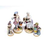 ~ A Meissen Porcelain Figure of a Girl, circa 1900, in 18th century costume playing cards on a