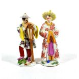 A Meissen Porcelain Figure of a Chinese Man, 20th century, standing holding a large fan, on a