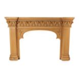 An Impressive Victorian Carved Fire Surround, late 19th century, of breakfront form, the cornice