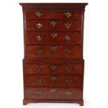 ~ A George III Mahogany Chest on Chest, late 18th century, with a Greek Key dentil cornice above a
