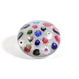 A Clichy Spaced Millefiori Paperweight, circa 1850, set with nineteen canes on a white gauze ground