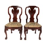 A Fine Pair of Figured Walnut and Beech Dining Chairs, circa 1720, the curved and scrolled top rails