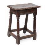 An Oak Joint Stool, circa 1680, the four peg rectangular top with carved edge above a moulded