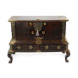 A 19th Century Hardwood and Brass Bound Zanzibar Chest on Stand, with decorated brass strapwork