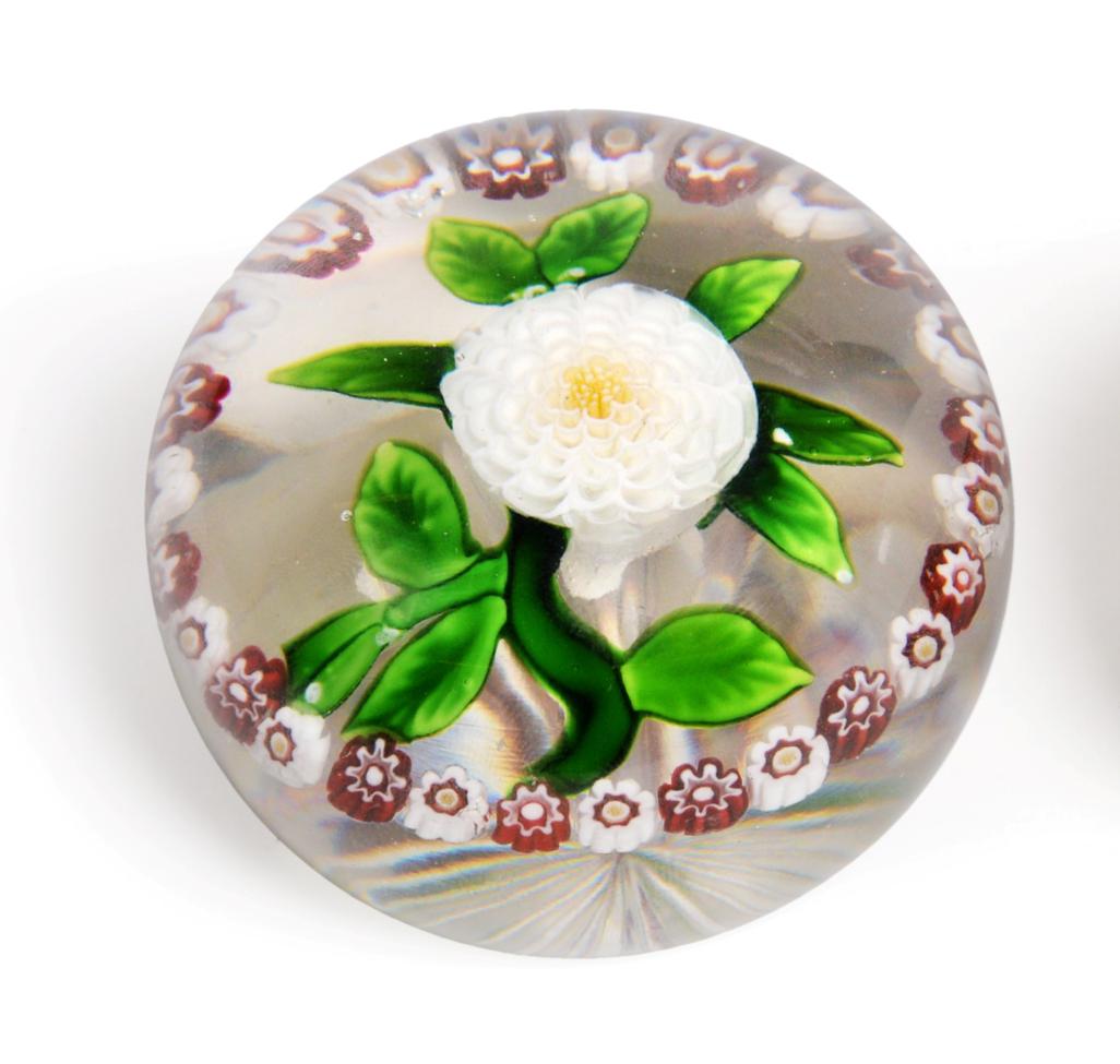 A Baccarat Garlanded Pompom Paperweight, circa 1850, the central white dahlia with green stem and