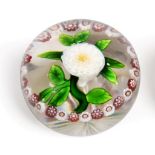 A Baccarat Garlanded Pompom Paperweight, circa 1850, the central white dahlia with green stem and