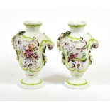 A Pair of Derby Porcelain Rococo Scroll Moulded Vases, circa 1765, painted with birds in