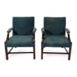 A Pair of Late 19th Century Gainsborough Style Library Armchairs, covered in blue close-nailed