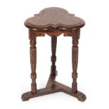 A Late 16th Century Style Trefoil Form Joined Oak Stool, the moulded top above a moulded and carved