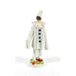 A Meissen Porcelain Figure of Pierrot, 20th century, standing wearing a mask and white robes with