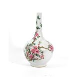 A Chinese Porcelain Bottle Vase, painted in famille rose enamels with blossoming tree peony and