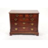 A George III Mahogany and Crossbanded Straight Front Chest of Drawers, circa 1780, the moulded top