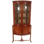 ~ A Late 19th Century Satinwood and Ebony Strung Bowfront Hanging Corner Cupboard, the arcaded