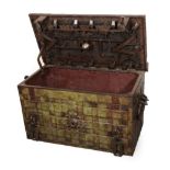 A 17th Century German Iron Armada Chest, with strap work design and painted green, the hinged lid