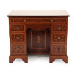 A Late Victorian Mahogany, Satinwood Banded, Ebony Strung and Marquetry Inlaid Kneehole Desk,
