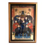Chinese School (Qing Dynasty) An Ancestor Portrait, depicting nine seated figures before a table