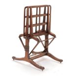 An Early Victorian Rosewood Folio Stand, circa 1840, the two pivoting supports with ratchet arms, on