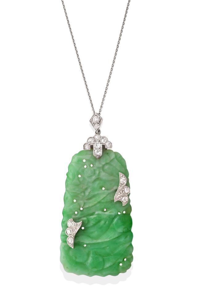 An Art Deco Jade and Diamond Plaque Pendant on Chain, the tapered oblong plaque carved and pierced