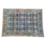 Veramin Carpet Central Iran, circa 1950 The indigo diamond lattice field of stylised flowerheads