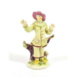 A Bow Porcelain Commedia dell'Arte Figure of Pierrot, circa 1760, standing wearing a pink hat and