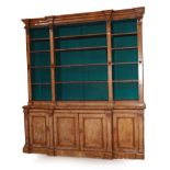 An Early Victorian Burr Walnut Breakfront Library Bookcase, circa 1860, the upper section with a