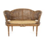 ~ A Late 19th/Early 20th Century Carved Giltwood Two-Seater Sofa, the double canted back support