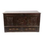 A 17th Century Joined Oak Chest, initialled and dated MB 82, the moulded hinged lid enclosing a