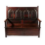 A George III Joined Oak Settle, early 19th century, the back support with four moulded panels with