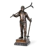 German School (early 20th century): A Bronze Figure of a Skier, walking holding his skis over his