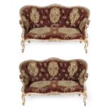 A Pair of Louis XV Style Carved Giltwood and Cream Painted Canapes, circa 1880, of serpentine shaped