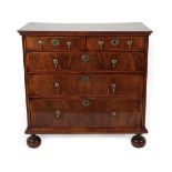 A George I Walnut and Feather-Banded Straight Front Chest of Drawers, early 18th century, the