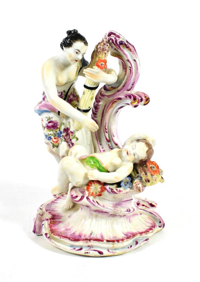 A Bow Porcelain Figure of Summer, circa 1765, as a classical maiden holding a sheaf of corn, a putto