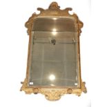 ~ A George I Gilt and Gesso Pier Glass, circa 1720, the bevelled mercury plate within a moulded