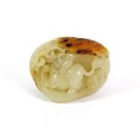 A Chinese Celadon and Russet Jade Pebble, Qing Dynasty, carved with a rat amongst foliage, 4.5cm