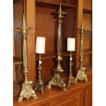 ^ A pair of Victorian brass pricket candlesticks, 66cm high; a large example, 79cm high; and a
