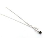 A white and black diamond pendant, marks indistinct, on a platinum chain, pendant length 3cm,