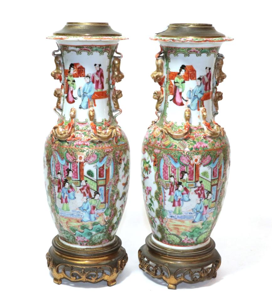 A pair of 19th century Canton Famille rose vases, converted to table lamps with gilt metal mounts