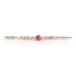 A ruby and diamond set bar brooch, unmarked, length 6.4cm . Gross weight 3.71 grams.